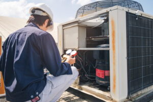 Technician is checking air conditioner